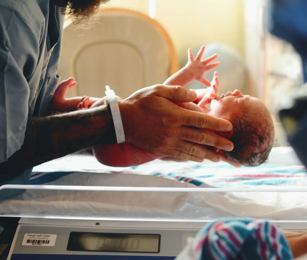 Maternity healthcare team collaborating on patient safety in a modern hospital setting